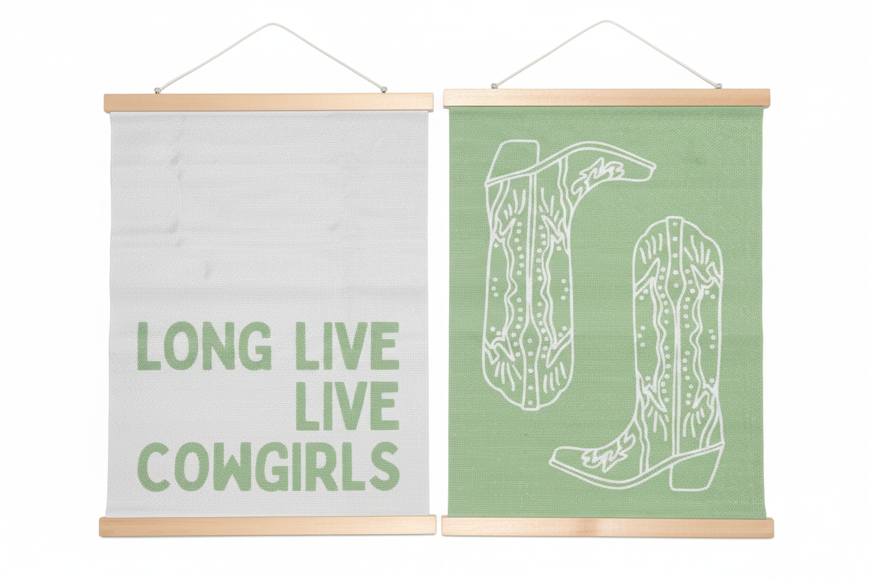 Two canvas wall hangings with wood dowel frames - Long Live Cowgirls and cowboy boots on white background