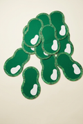 Green putting-green-shaped golf party decorations on an ivory background