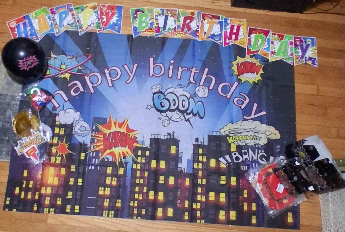 Superhero happy birthday party decor bundle with city skyline backdrop, banner, balloons and accessories